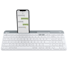 Load image into Gallery viewer, Logitech K580 Slim Multi-Device Wireless Keyboard in white with docked phone